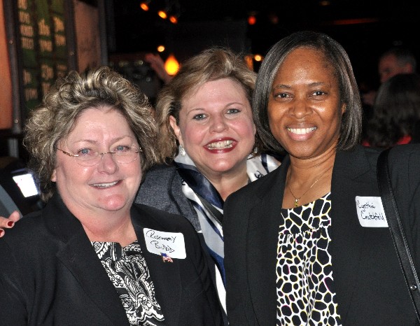 Rosemary Budd (l), director, strategic programs, Lockheed Martin IS&GS National; Colleen Dilly (c), AEITS, WIIG lead; and Cynthia Crutchfield, vice president, OCEUS Networks, gathering at the networking event in March.